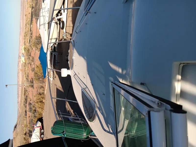 Slide: The Image of 2001 Celebrity 280 Express Cruiser docked, top view with clear sky background. - 17