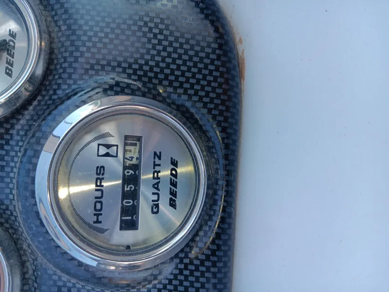 Slide: The Image of Hour meter on 2001 Celebrity 280 Express Cruiser dashboard, showing 597.1 hours. - 20