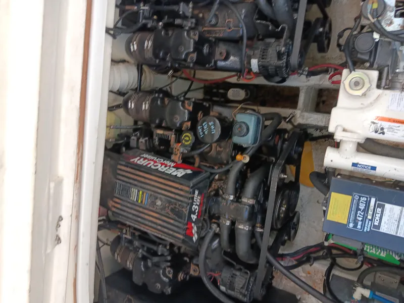 Slide: The Image of Engine compartment of a 2001 Celebrity 280 Express Cruiser with visible mechanical components. - 26