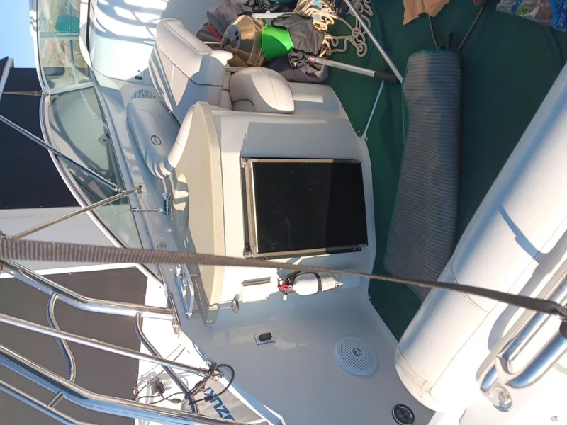 Slide: The Image of 2001 Celebrity 280 Express Cruiser interior with seating and boating equipment. - 6