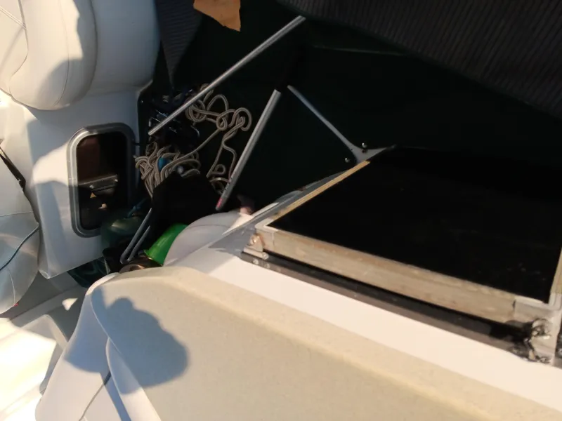 Slide: The Image of Interior view of a 2001 Celebrity 280 Express Cruiser boat, showing seating and storage area. - 7