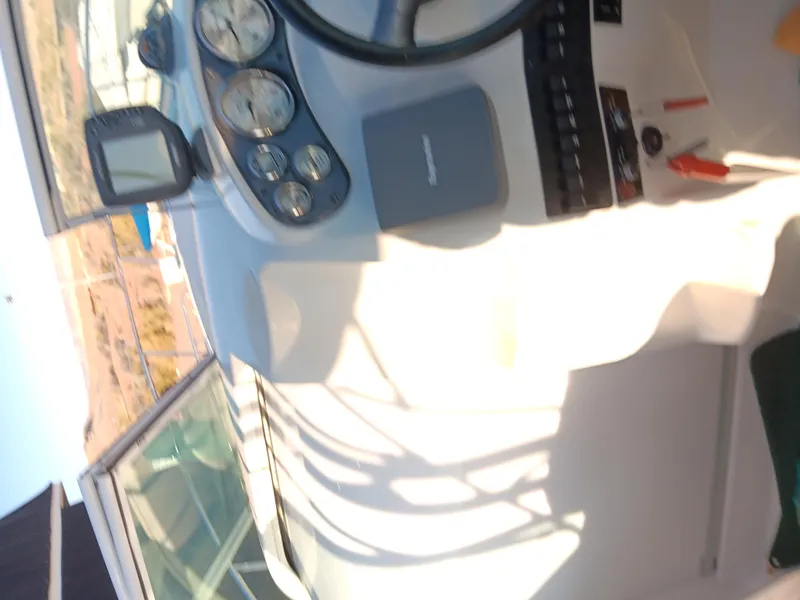 Slide: The Image of 2001 Celebrity 280 Express Cruiser dashboard with gauges and controls. - 8