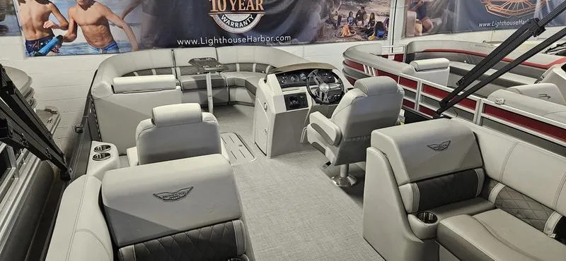 Slide: The Image of 2025 Bennington 23LSR pontoon boat interior with luxurious seating and modern dashboard. - 6