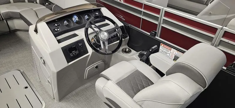 Slide: The Image of 2025 Bennington 23LSR boat interior with modern steering console and comfortable seating. - 8