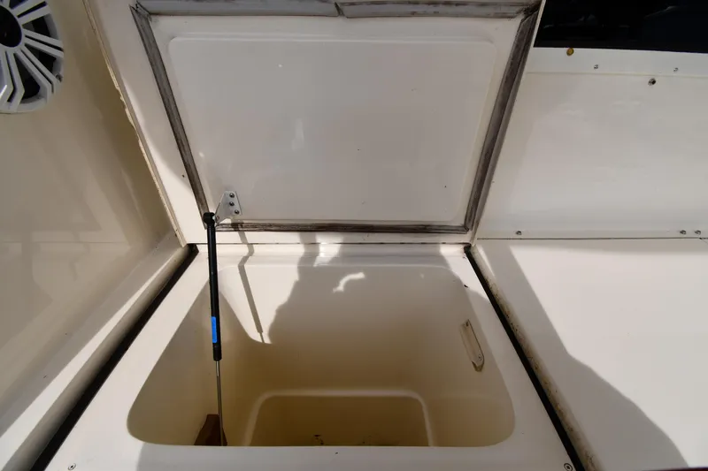 Slide: The Image of Open storage compartment on a 1990 Viking 53 Convertible boat. - 21