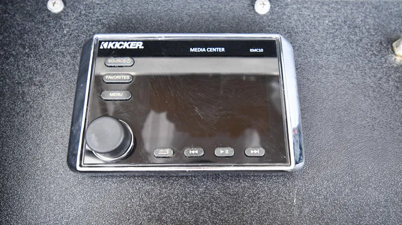 Slide: The Image of Kicker media center on 1990 Viking 53 Convertible boat dashboard. - 33