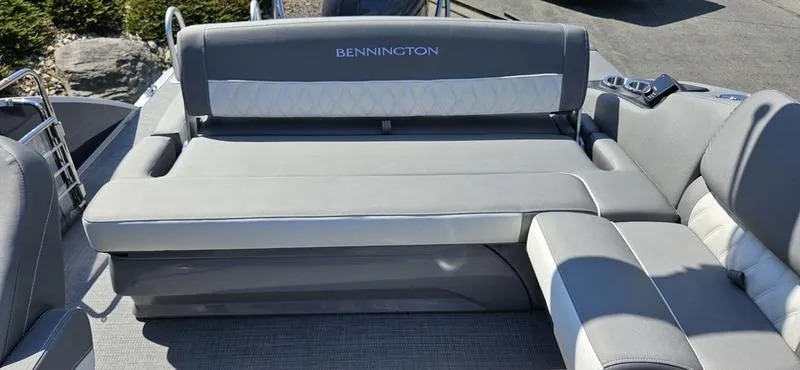Slide: The Image of 2025 Bennington 23 RSB boat interior with gray seating and modern design. - 10