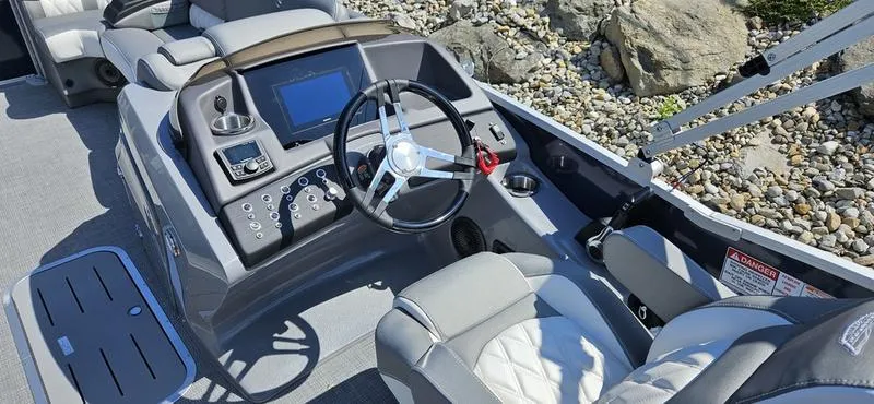 Slide: The Image of 2025 Bennington 23 RSB boat interior with modern dashboard and steering wheel. - 5