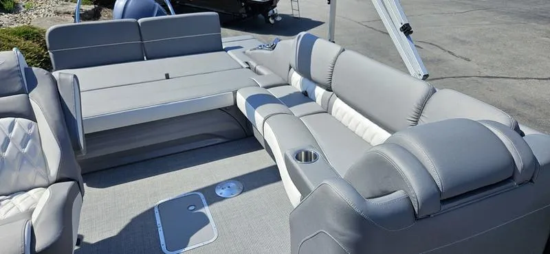 Slide: The Image of 2025 Bennington 23 RSB boat interior with gray seating and cup holders. - 9