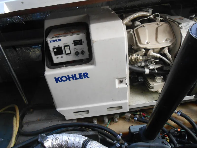 Slide: The Image of Kohler generator in 1995 Larson 280 Cabrio boat engine compartment. - 22