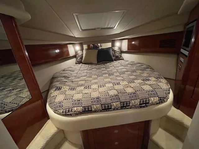 Slide: The Image of Luxurious cabin interior of 2005 Sea Ray 390 Sundancer yacht with cozy bed. - 23