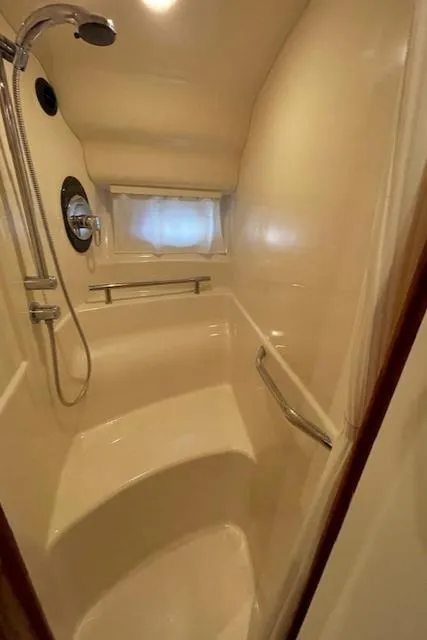 Slide: The Image of Shower area in 2005 Sea Ray 390 Sundancer yacht, featuring sleek design and modern fixtures. - 25