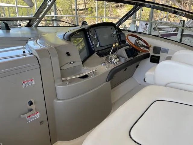 Slide: The Image of 2005 Sea Ray 390 Sundancer helm with modern controls and comfortable seating. - 3