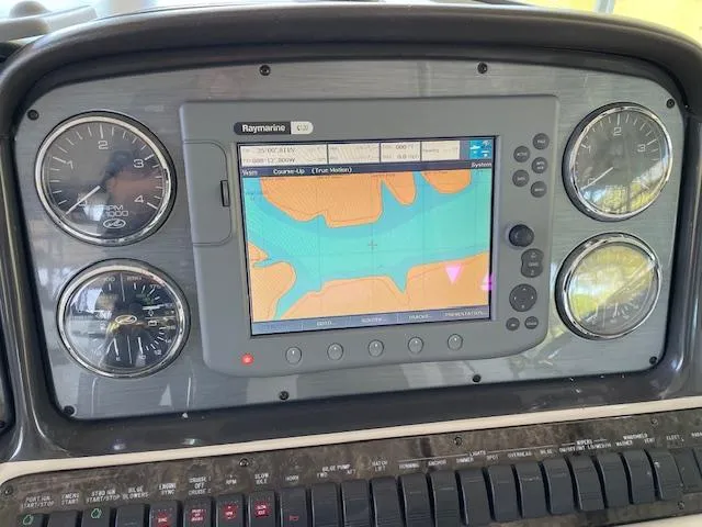 Slide: The Image of Dashboard of 2005 Sea Ray 390 Sundancer with navigation system and gauges. - 6