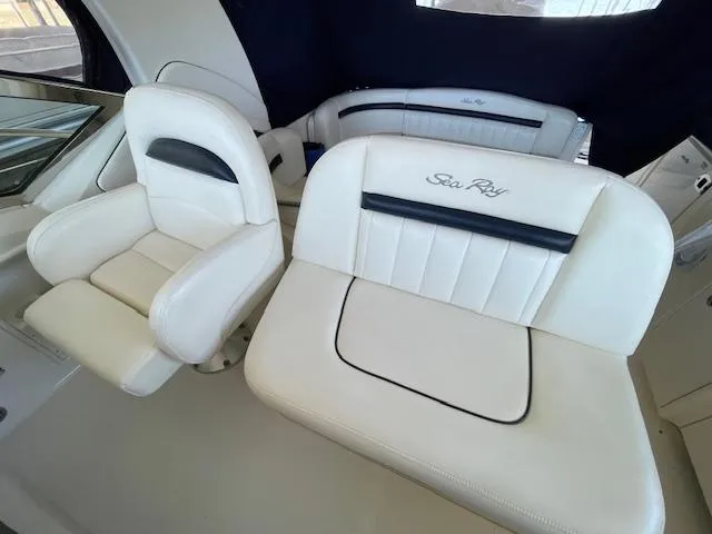 Slide: The Image of 2005 Sea Ray 390 Sundancer interior with white leather seating. - 7