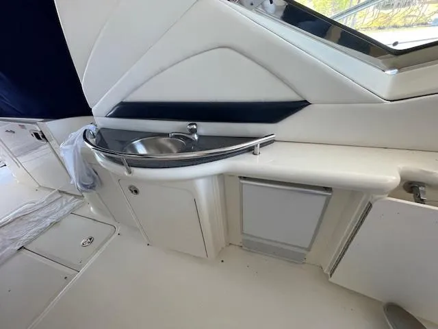 Slide: The Image of 2005 Sea Ray 390 Sundancer interior with sink and storage area. - 8