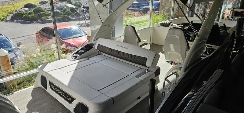 Slide: The Image of 2025 Bennington R 25 RSBA boat interior with seating and helm station. - 11