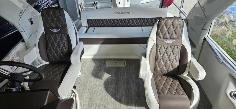 Slide: The Image of Interior of 2025 Bennington R 25 RSBA boat with luxurious seating and modern design. - 12