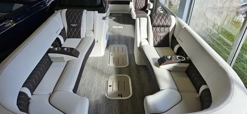 Slide: The Image of Luxurious interior of 2025 Bennington R 25 RSBA pontoon boat with plush seating. - 14