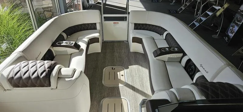 Slide: The Image of Luxurious interior of 2025 Bennington R 25 RSBA pontoon boat with plush seating. - 4