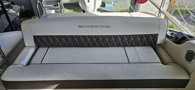 Slide: The Image of 2025 Bennington R 25 RSBA boat seating with elegant diamond-patterned upholstery. - 8