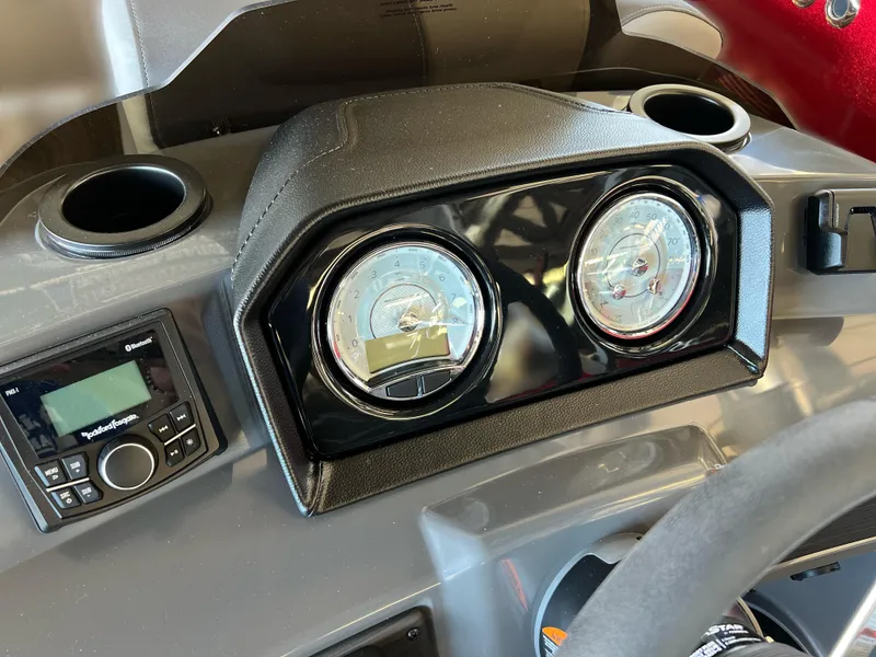 Slide: The Image of Dashboard of 2025 Bennington 168 SL boat with gauges and stereo system. - 12