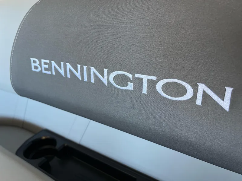 Slide: The Image of 2025 Bennington 168 SL boat seat with logo and cup holder. - 13