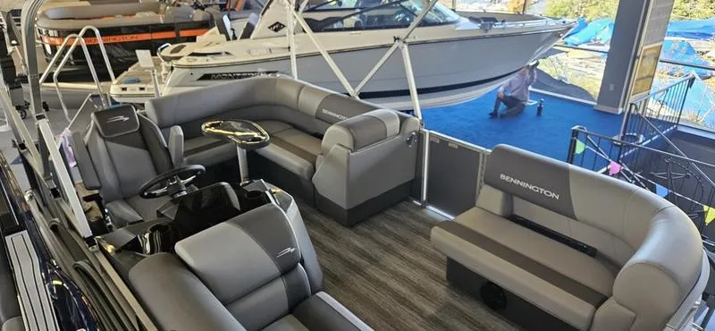 Slide: The Image of 2025 Bennington 168 SL pontoon boat interior with gray seating and modern design. - 2