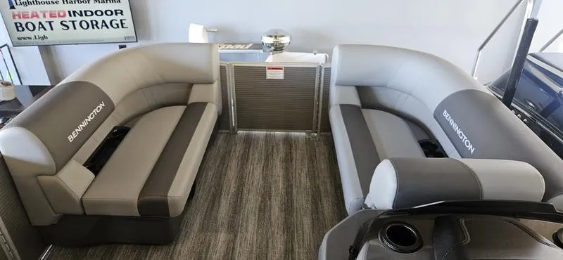 Slide: The Image of 2025 Bennington 168 SL boat interior with gray seating and modern design. - 3