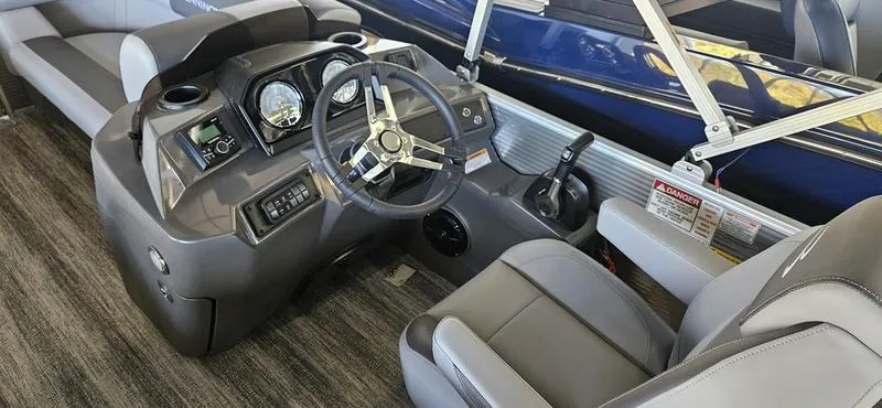 Slide: The Image of 2025 Bennington 168 SL boat interior with steering wheel and dashboard controls. - 4