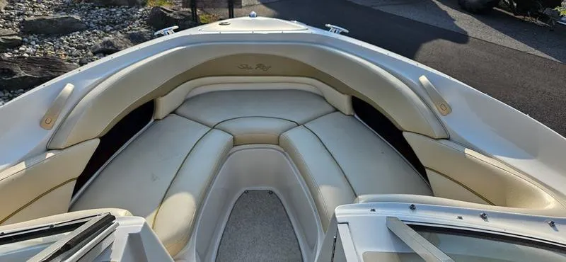 Slide: The Image of 2001 Sea Ray 230 Bow Rider interior with white leather seating. - 10