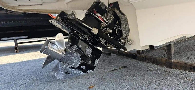 Slide: The Image of 2001 Sea Ray 230 Bow Rider with corroded MerCruiser outdrive on trailer. - 3