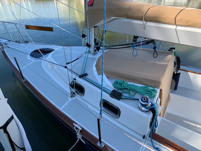 Slide: The Image of 2022 Tartan Fantail sailboat docked, featuring sleek design and modern rigging. - 13