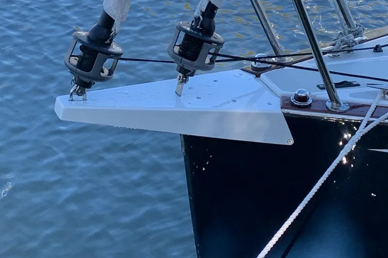 Slide: The Image of Bow of 2022 Tartan Fantail sailboat with rigging details on water. - 29