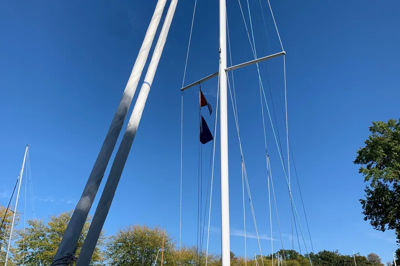 Slide: The Image of Sailboat mast of 2022 Tartan Fantail against clear blue sky. - 31