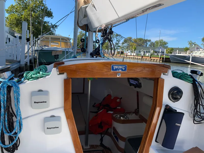 Slide: The Image of 2022 Tartan Fantail sailboat interior with navigation equipment and moored at a marina. - 8