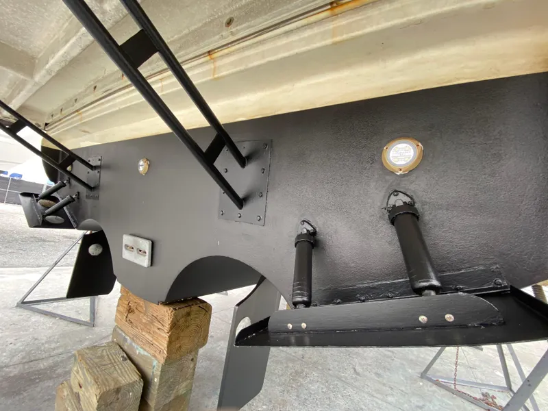 Slide: The Image of 2006 Cruisers Yachts 52 Express hull detail with trim tabs and supports. - 105