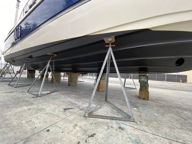 Slide: The Image of 2006 Cruisers Yachts 52 Express on stands, showcasing hull design. - 107