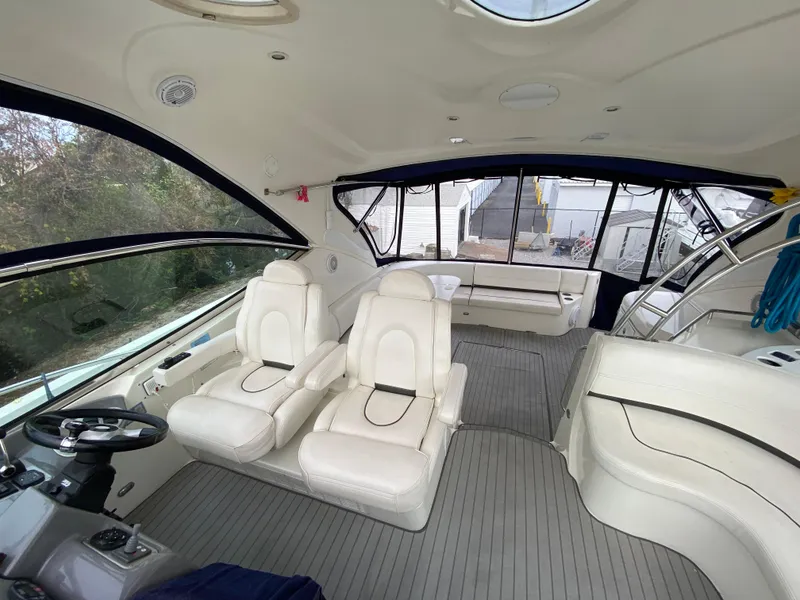 Slide: The Image of Luxurious 2006 Cruisers Yachts 52 Express interior with plush seating and modern design. - 19