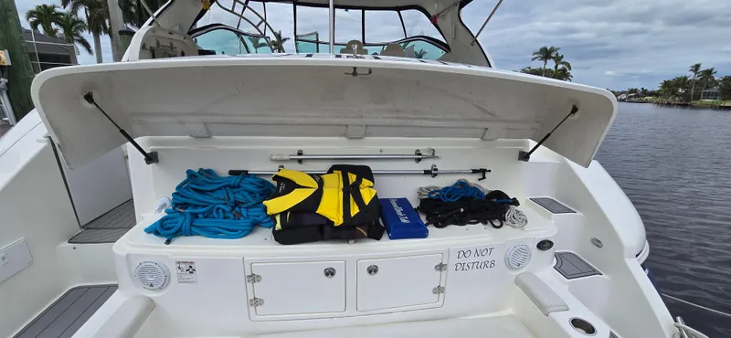 Slide: The Image of 2006 Cruisers Yachts 52 Express boat deck with storage and safety gear. - 28