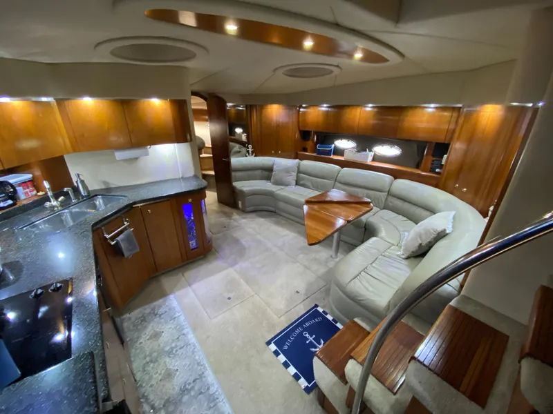 Slide: The Image of Luxurious interior of 2006 Cruisers Yachts 52 Express with modern kitchen and cozy seating area. - 41