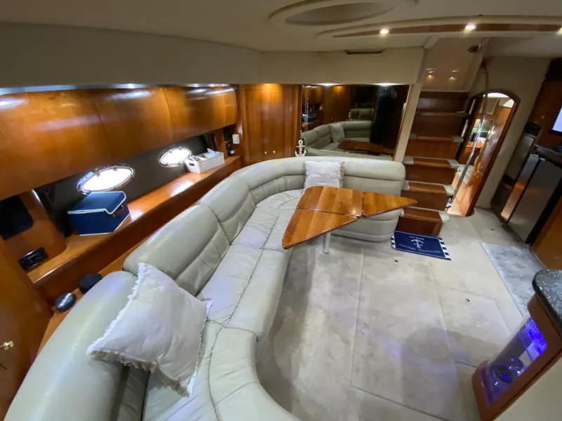 Slide: The Image of Luxurious interior of 2006 Cruisers Yachts 52 Express with plush seating and elegant wood finishes. - 44