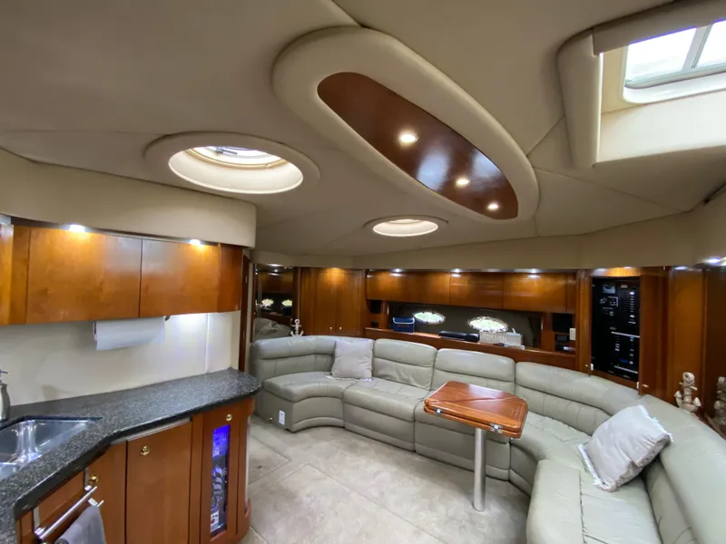 Slide: The Image of Luxurious 2006 Cruisers Yachts 52 Express interior with elegant seating and modern amenities. - 45