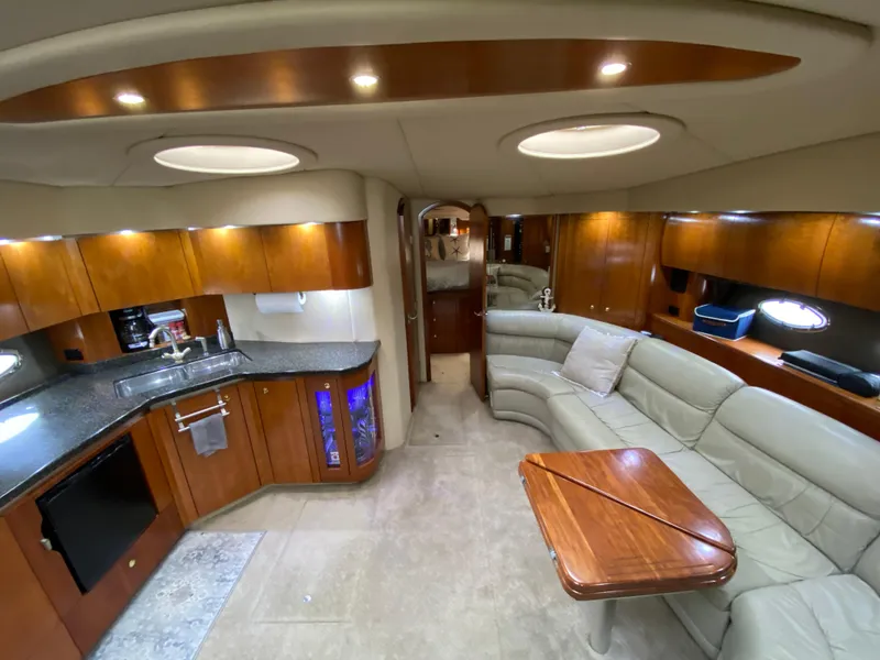 Slide: The Image of Luxurious 2006 Cruisers Yachts 52 Express interior with modern kitchen and cozy seating area. - 46
