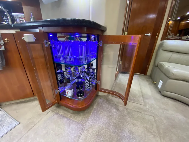 Slide: The Image of Luxury yacht interior with illuminated liquor cabinet, Cruisers Yachts 52 Express, 2006 model. - 47