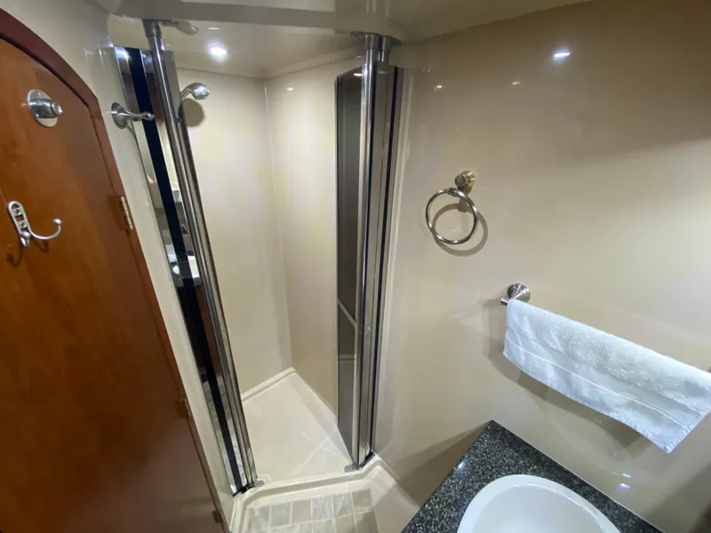 Slide: The Image of Luxurious bathroom in 2006 Cruisers Yachts 52 Express with shower and modern fixtures. - 61