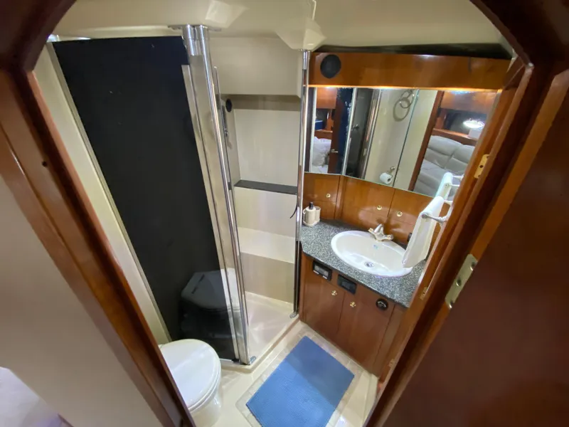Slide: The Image of Luxurious bathroom in 2006 Cruisers Yachts 52 Express with shower and vanity. - 68