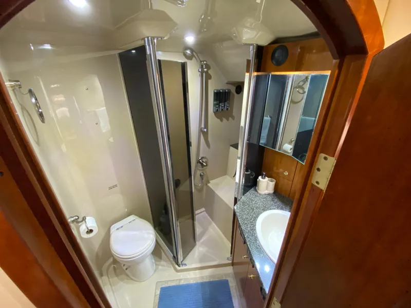 Slide: The Image of Luxurious bathroom in 2006 Cruisers Yachts 52 Express with shower and vanity. - 69