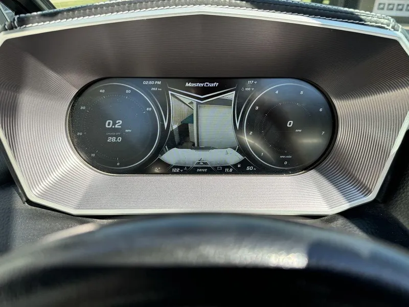 Slide: The Image of 2018 MasterCraft X23 dashboard display with speedometer and RPM gauges. - 10