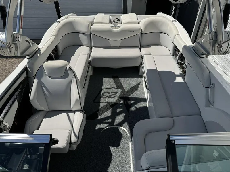 Slide: The Image of 2018 MasterCraft X23 boat interior with white seating and modern design. - 3